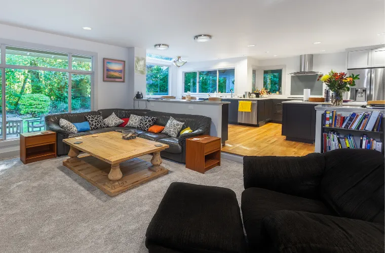 Kitchen addition remodel in progress with new flooring, cabinetry installation, and construction materials on site in Los Angeles home