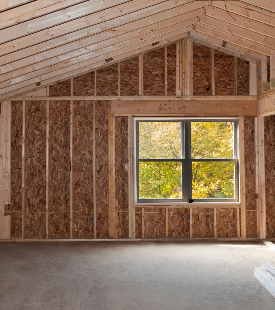 Second-story addition framing with new roof structure and insulated wall construction in a Los Angeles home