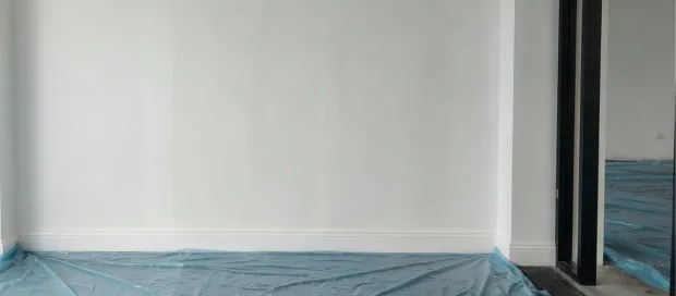 Commercial-grade insulation installed behind drywall