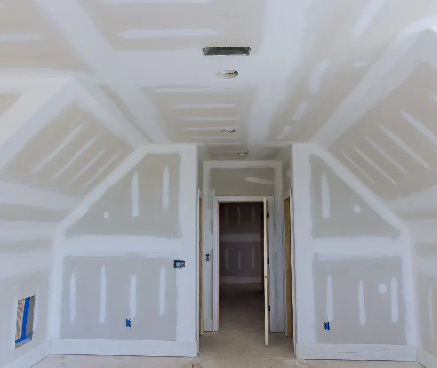 Professional contractor installing structural panels during a second-story addition in Los Angeles